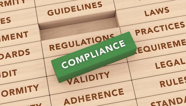 Compliance Wooden Blocks Concept with Green Color with background words Legal, regulation, requirement, conformity, policies, adherence , rules, practices, standards